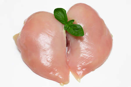 Two fresh raw chicken breasts on white background.の写真素材