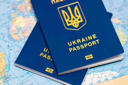 Ukrainian travel passport on a world map.の写真素材