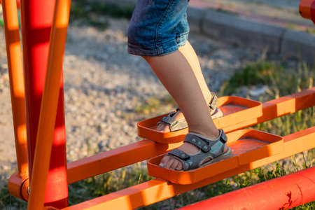 Boy is engaged on a simulator on the street.の写真素材