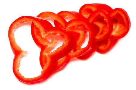 Red sweet bell pepper slices isolated on white background.の写真素材