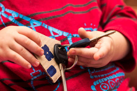 The keys of the house in children's hands.