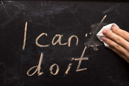 Changing the word I can't to I can do it text on  blackboard background.