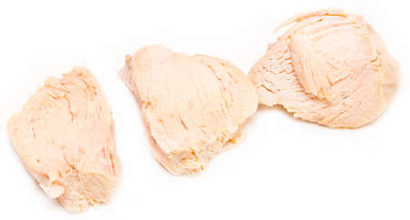 Pieces of boiled chicken breast over white background.の写真素材
