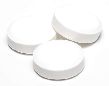 white pill isolated on white background close-up.