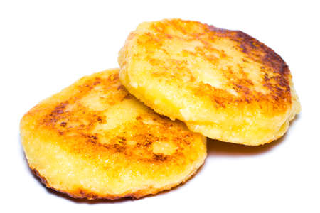 freshly baked cottage cheese pancakes isolated on white.