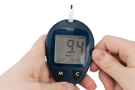 medicine, diabetes, glycemia, health care and people concept - close up of man checking blood sugar...