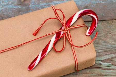 Christmas decoration. Boxes with Christmas gifts. Beautiful packaging. Vintage gift box on wooden background. Handmade.の写真素材