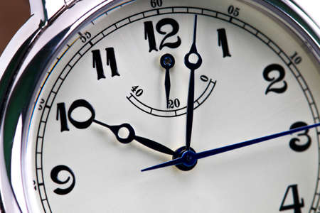 Close-up of a men's wrist watch isolated on white background.