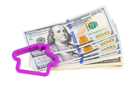 Miniature house with money on a white background.の写真素材