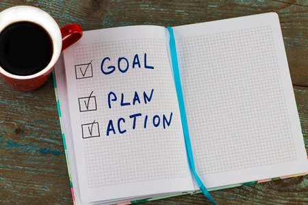 New year goal, plan, action - Text on notepad with cup of coffee. Business motivation,inspiration concepts.の写真素材