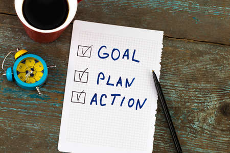 New year goal, plan, action - text on notepad with cup of coffee. Business motivation,inspiration concepts.の写真素材