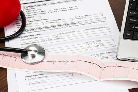 Laptop and stethoscope and medical records, medical concept.の写真素材