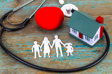 Concept of insurance over a house, Medical Insurance and a family.の写真素材