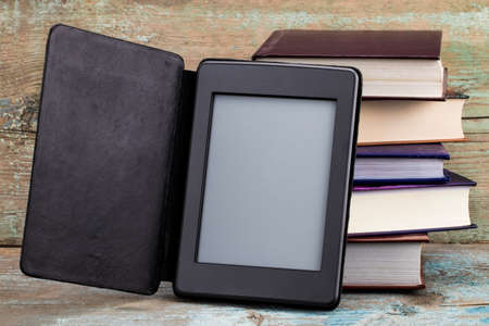 E-book and old books. New technologies in book publishing.の写真素材