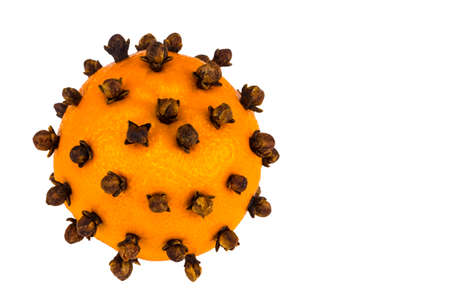 Aromatic Christmas orange with cloves on white background.の写真素材