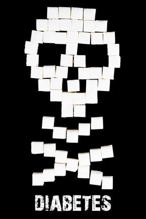 Deadly sugar addiction suggested by spilled white sugar crystals forming a skull. Diabetes mellitus concept.の写真素材
