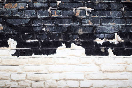 Old white and black brick wall texture for background.