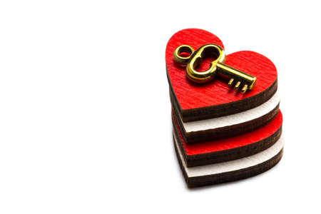 Stack of hearts with key on white background.Background Valentine's day. Copy space.の写真素材