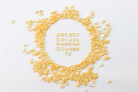 Alphabet made of macaroni letters isolated on white background.の写真素材