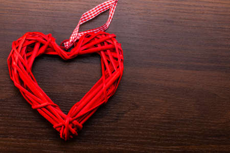 Valentine's day background with red hearts on wooden planks.の写真素材