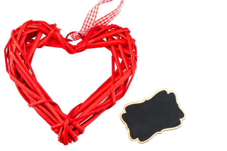  A red heart  and a blackboard on white background. Space for text. Valentine's day concept.の写真素材