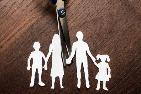 Divorce and child custody scissors cutting family apart.の写真素材