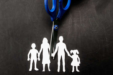 Divorce and child custody scissors cutting family apart.の写真素材