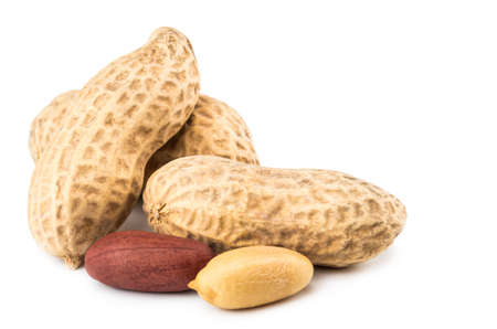 Peanuts isolated on the white background. Close up.
