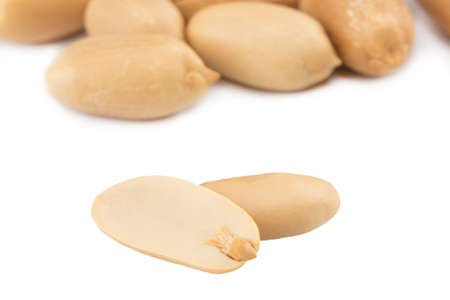 Peanuts isolated on the white background. Close up.