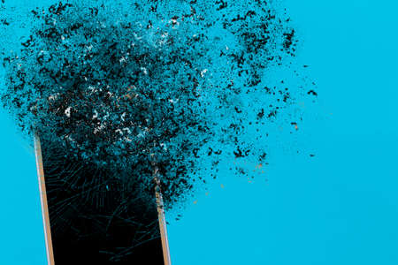 Smartphone explosion on blue background. Edit by using explosion effect.の写真素材
