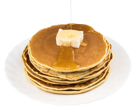 Stack of pancakes in syrup on white background.