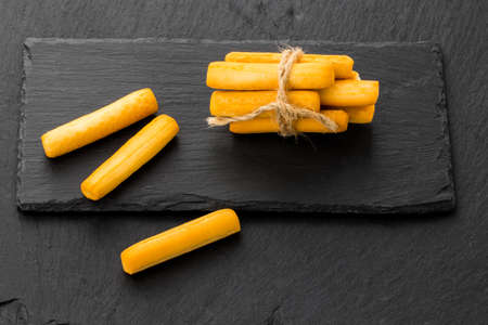 Crispy bread sticks on black stone background with copy space.の写真素材