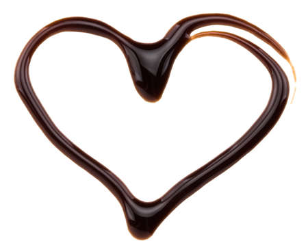 Heart made from chocolate syrup, isolated on white.の写真素材