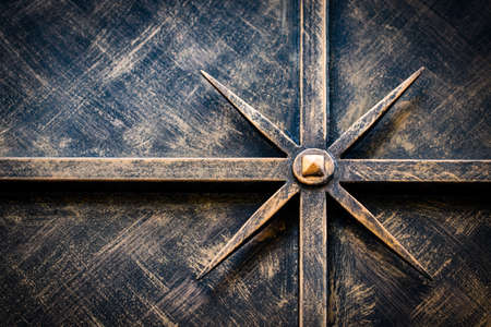 ornate wrought-iron elements of metal gate decoration.