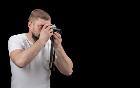  man hipster, holding a vintage camera in the hands. With copy space.の写真素材