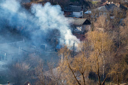 Fire with black smoke in house. House in smoke.の写真素材