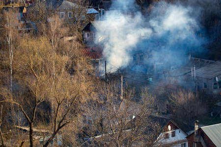 Fire with black smoke in house. House in smoke.