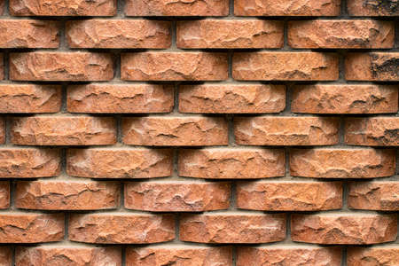 Weathered stained old brick wall background. close-up.の写真素材