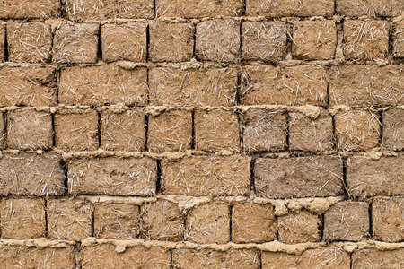 Weathered stained old brick wall background. close-up.