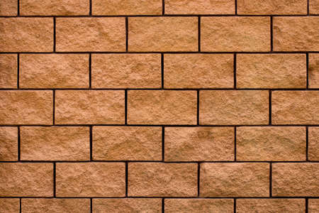Weathered stained old brick wall background. close-up.
