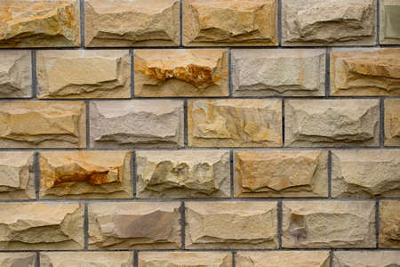 Weathered stained old brick wall background. close-up.