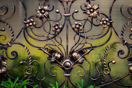 wrought-iron gates, ornamental forging, forged elements close-up.の写真素材