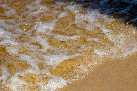 Wave of the sea on the sand beach.