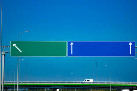 Big blank highway road sign with gradient blue sky.
