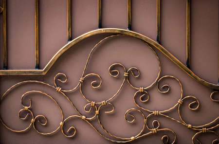 ornate wrought-iron elements of metal gate decoration.の写真素材