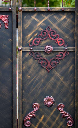wrought-iron gates, ornamental forging, forged elements close-up.