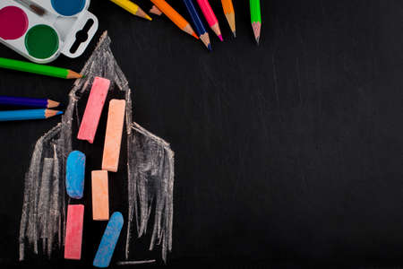 Back to school background with rocket made from pencils with copy space . View from above.の写真素材