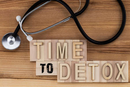 Time to Detox -  text in vintage letters on wooden blocks with stethoscope.の写真素材