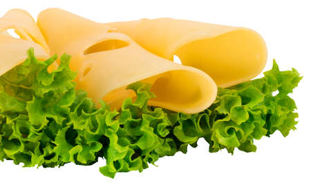 cheese slices and fresh green lettuce isolated on a white background.の写真素材