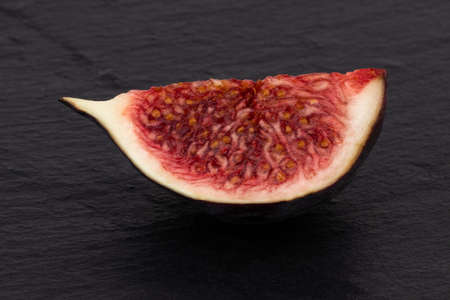 fresh figs on dark background with copy space.